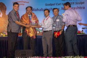 Dr. Venkataram Mysore being awarded with the lifetime achievement award at Dermazone South